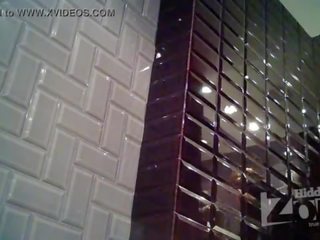Skinny damsel pee standing up. Her shaved pussy and anus right in front of spycam